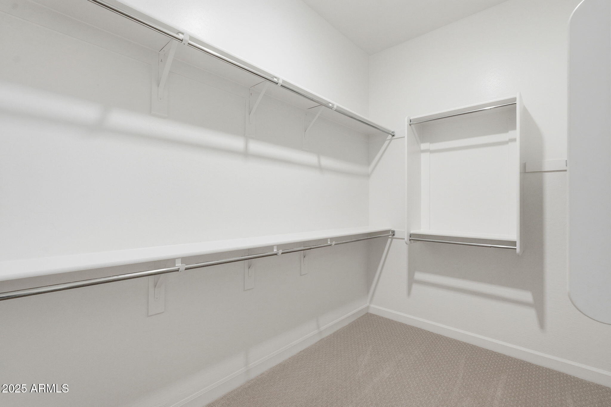 17927 West Long Lake Road Goodyear, AZ 85338 - Photo 16 of 36 a view of an empty walk in closet