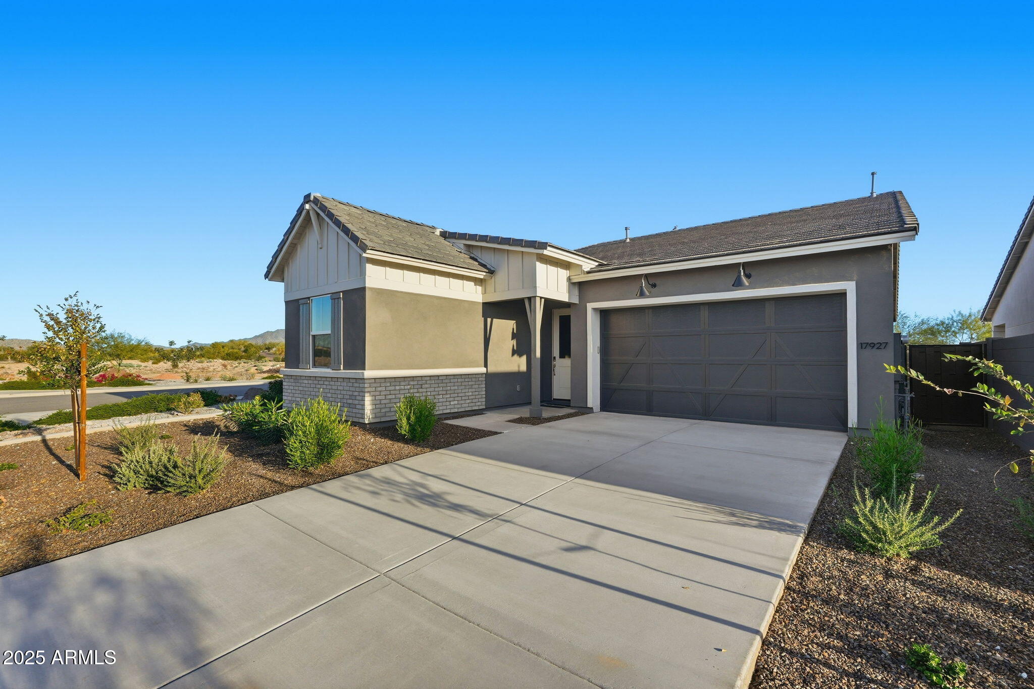 17927 West Long Lake Road Goodyear, AZ 85338 - Photo 2 of 36 a front view of a house with garden