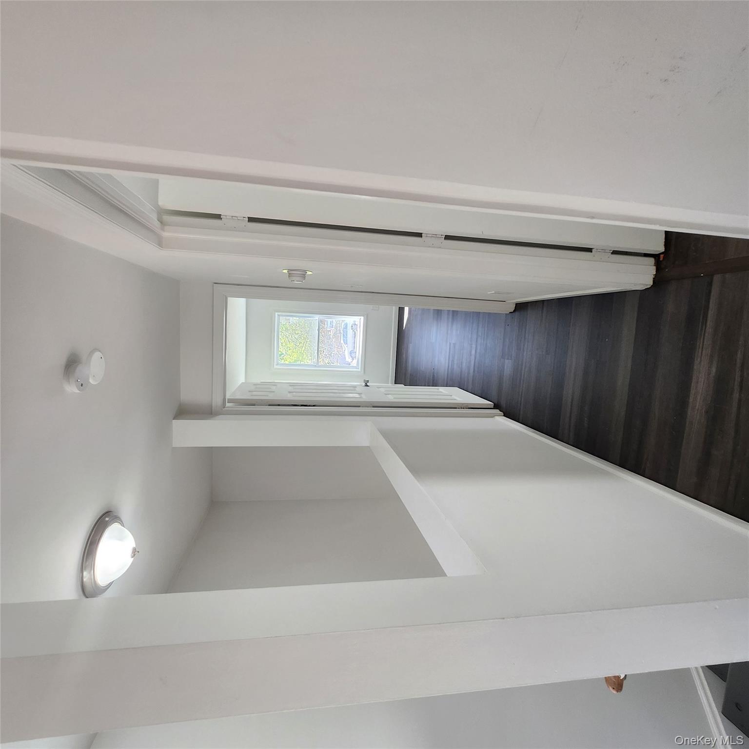 5 Morton Street Poughkeepsie, NY 12601 - Photo 18 of 23 a view of a hallway with wooden floor