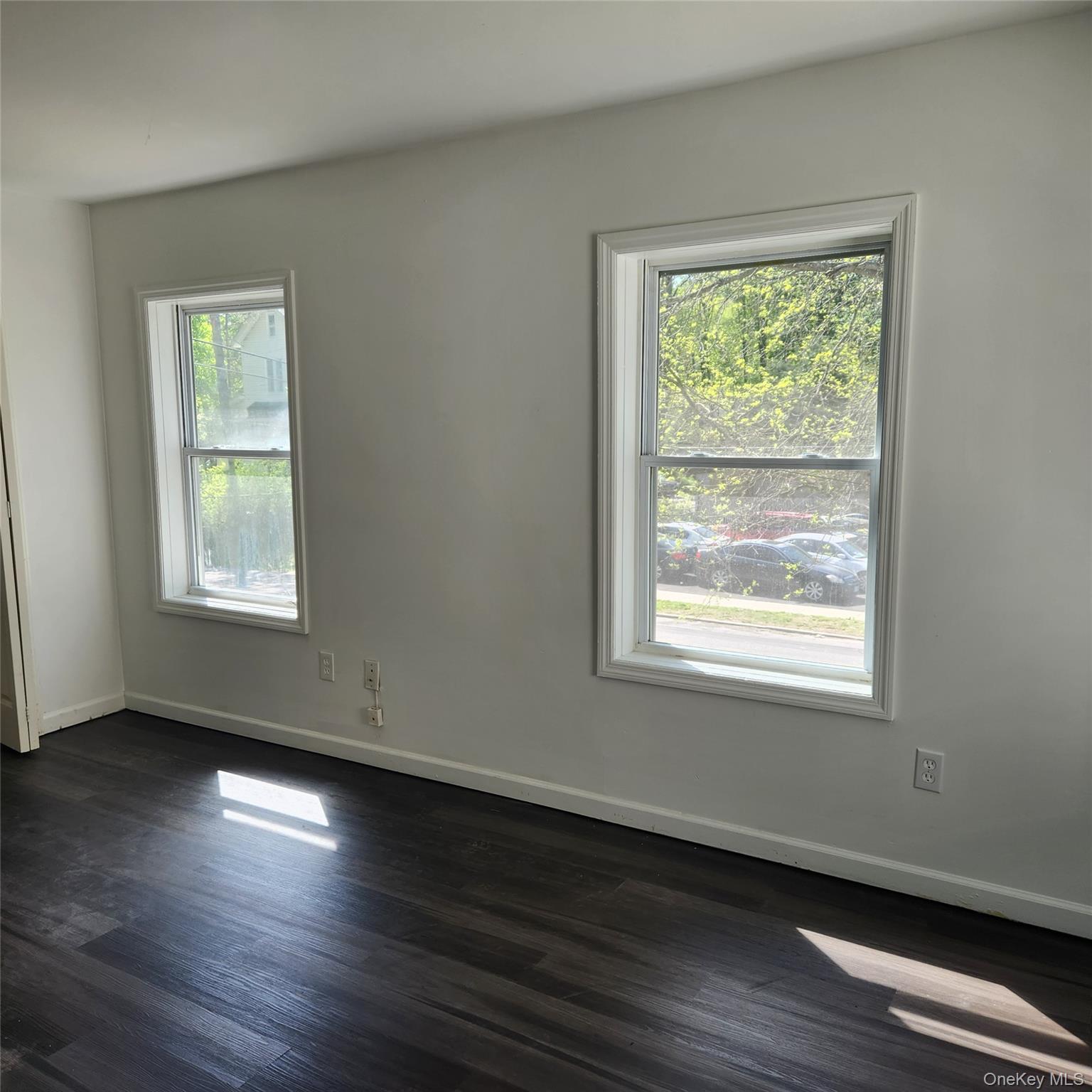 5 Morton Street Poughkeepsie, NY 12601 - Photo 10 of 23 a view of an empty room with wooden floor and a window