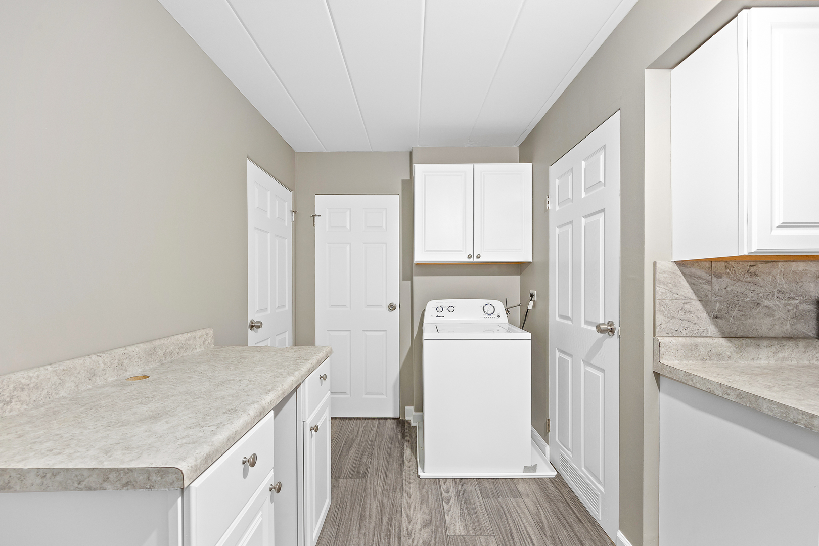 332 Maple Avenue, Unit 1 Downers Grove, IL 60515 - Photo 12 of 29 a bathroom with a granite countertop sink and a mirror
