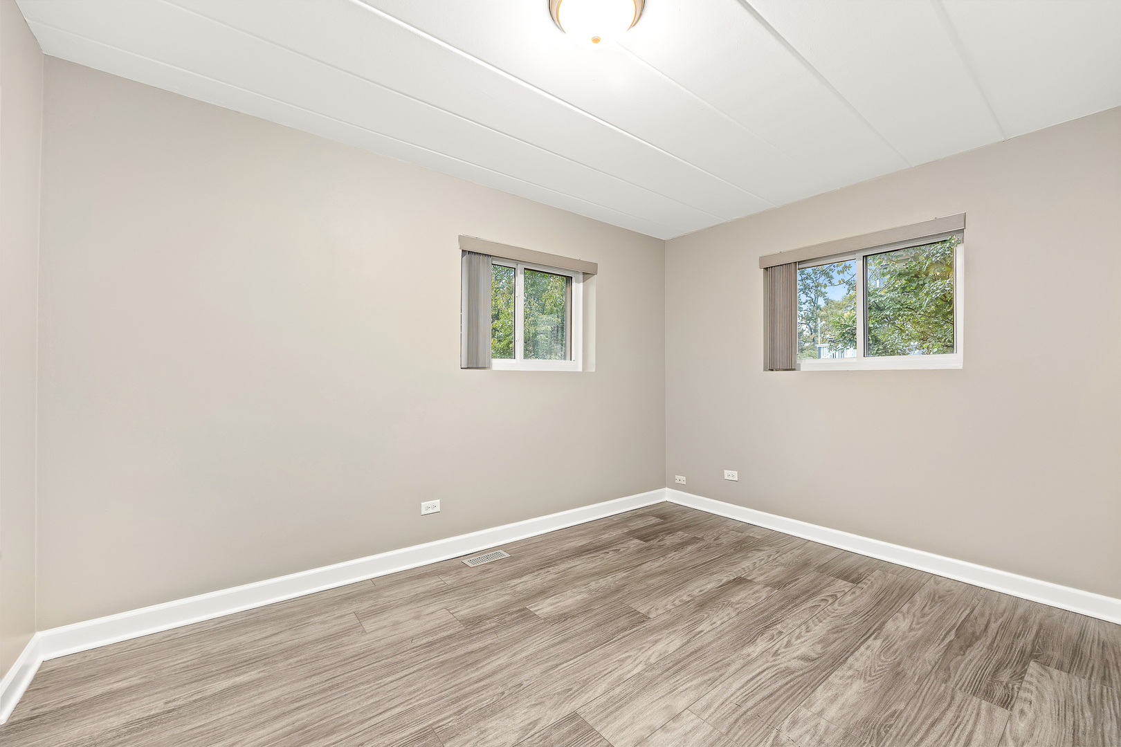 332 Maple Avenue, Unit 1 Downers Grove, IL 60515 - Photo 17 of 29 a view of room with wooden floor and window