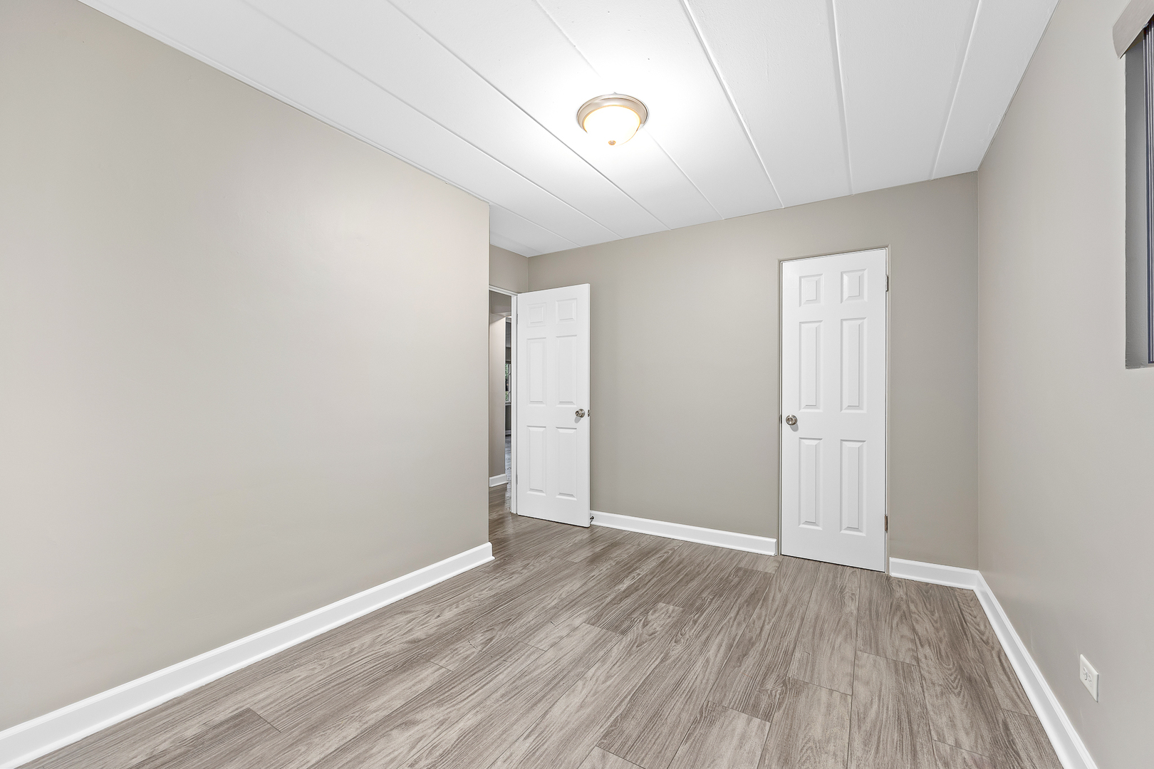 332 Maple Avenue, Unit 1 Downers Grove, IL 60515 - Photo 18 of 29 a view of an empty room with wooden floor