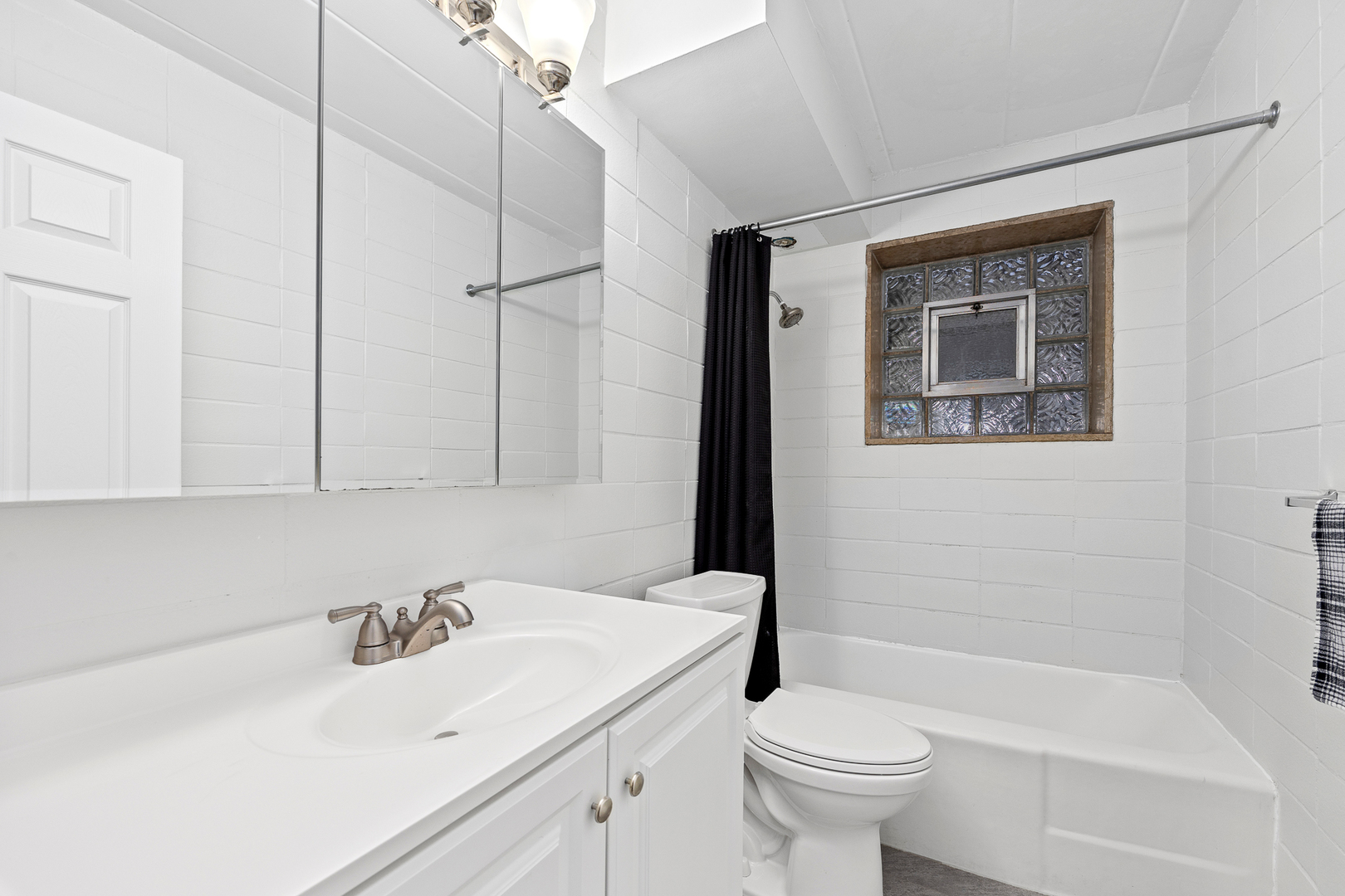 332 Maple Avenue, Unit 1 Downers Grove, IL 60515 - Photo 19 of 29 a bathroom with a sink toilet and shower