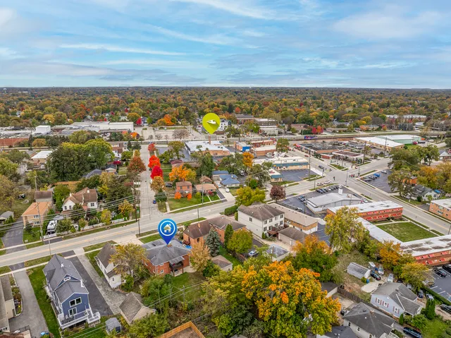 an aerial view of residential houses with outdoor space