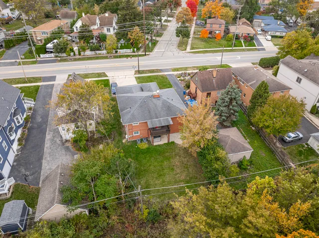 an aerial view of a house with a swimming pool