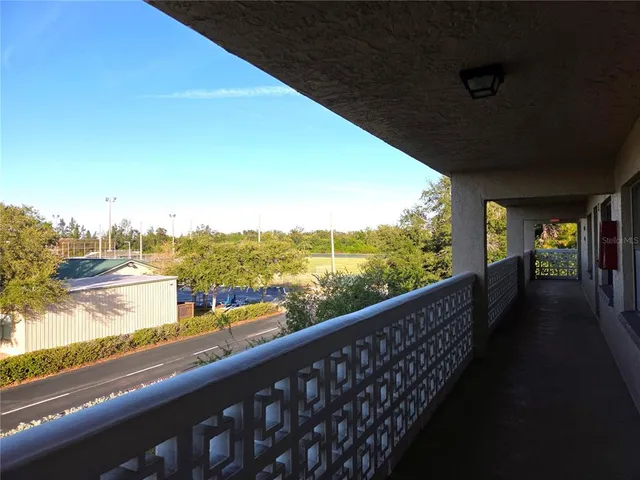 a view of city and mountain from a balcony