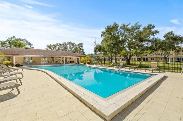 a view of a swimming pool with a terrace