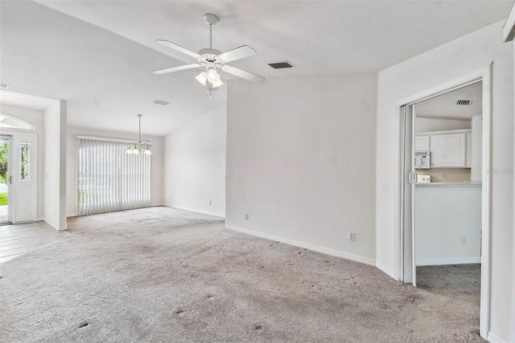 142 Morning Glory Circle Winter Haven, FL 33884 - Photo 11 of 36 an empty room with fan and entrance