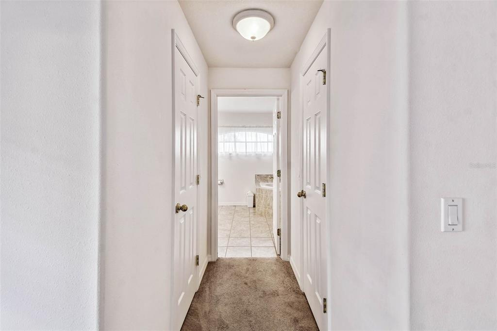 142 Morning Glory Circle Winter Haven, FL 33884 - Photo 18 of 36 a view of a hallway with a wooden door