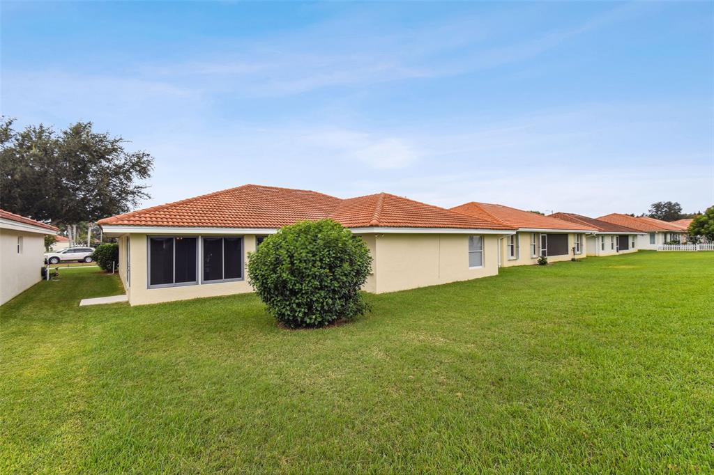 142 Morning Glory Circle Winter Haven, FL 33884 - Photo 29 of 36 a view of a house with a yard and a porch
