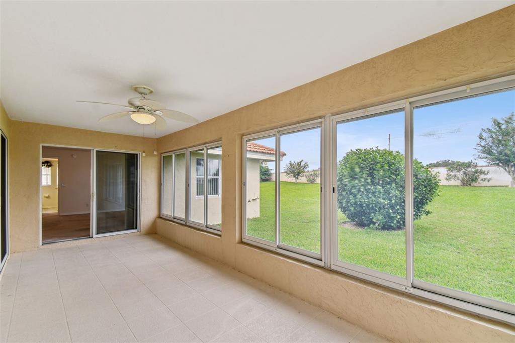 142 Morning Glory Circle Winter Haven, FL 33884 - Photo 7 of 36 a view of a big room with windows and entryway