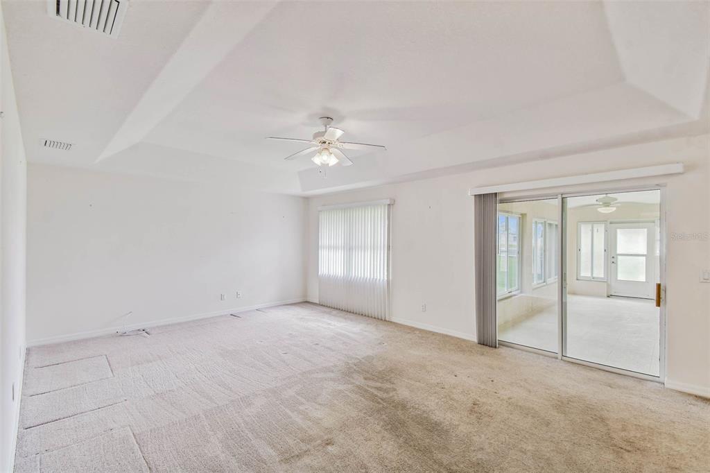 142 Morning Glory Circle Winter Haven, FL 33884 - Photo 10 of 36 a view of an empty room with chandelier fan