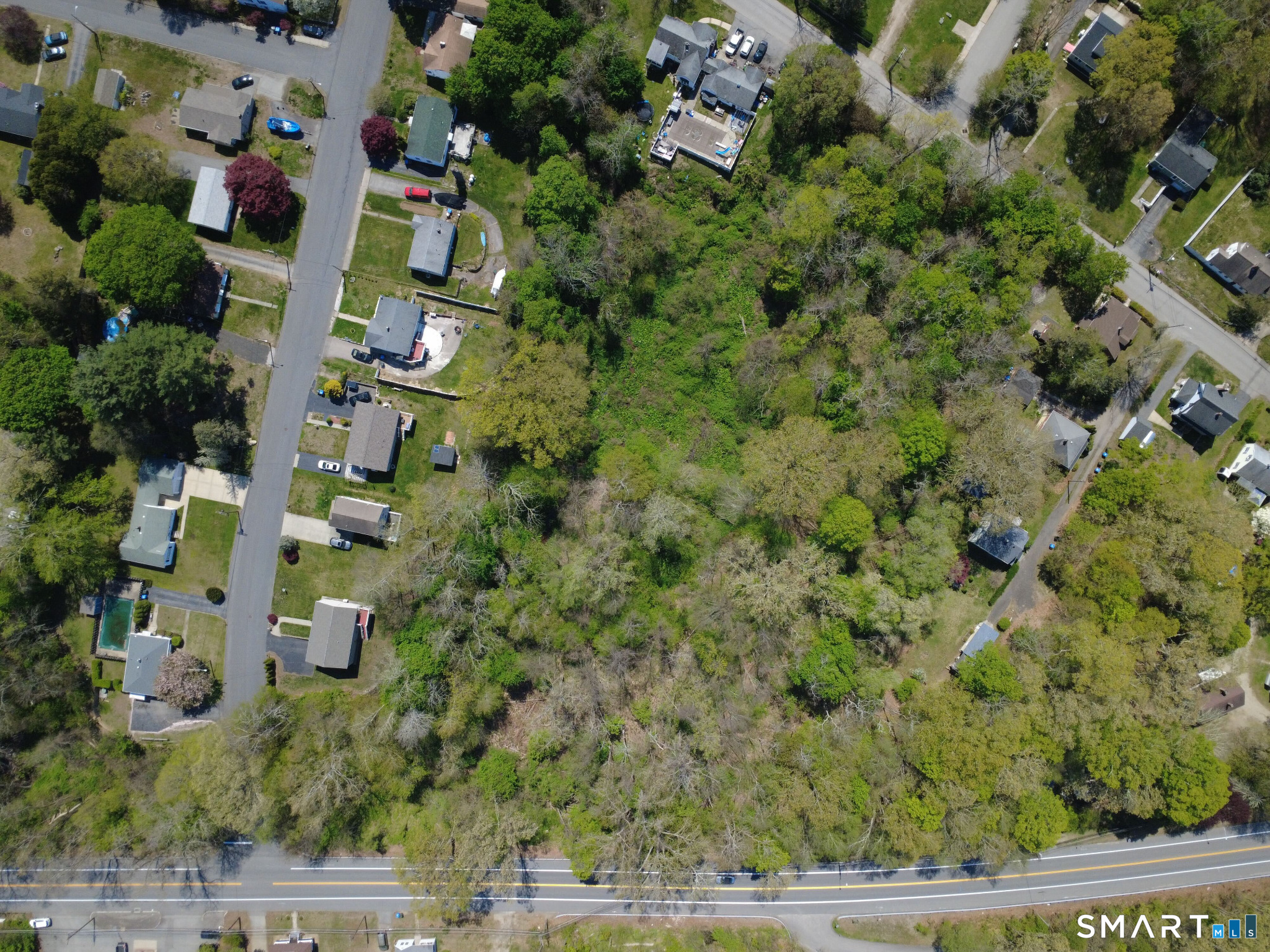 84 Corning Road Norwich, CT 06360 - Photo 5 of 12 an aerial view of residential houses with outdoor space and trees