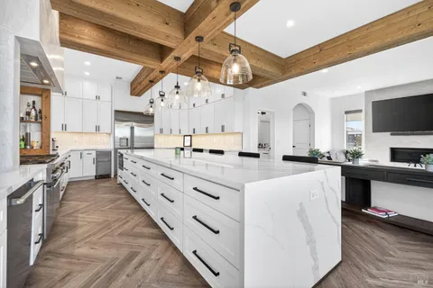 a bathroom with cabinets granite and a sink