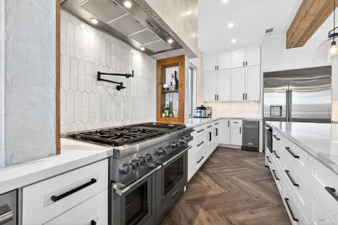 a view of a livingroom with furniture and a flat screen tv