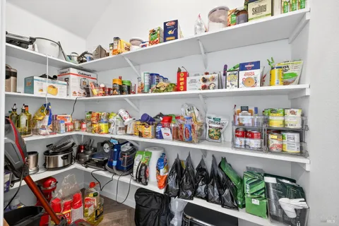 a view of a hallway with a dining space