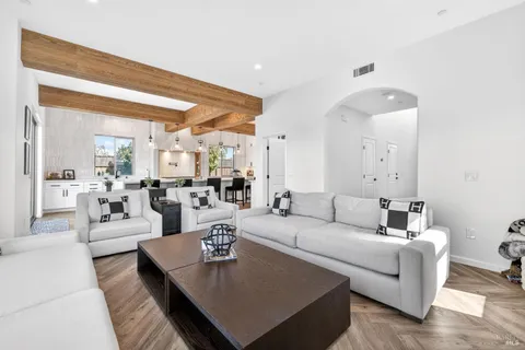 a bathroom with a double vanity sink mirror and shower