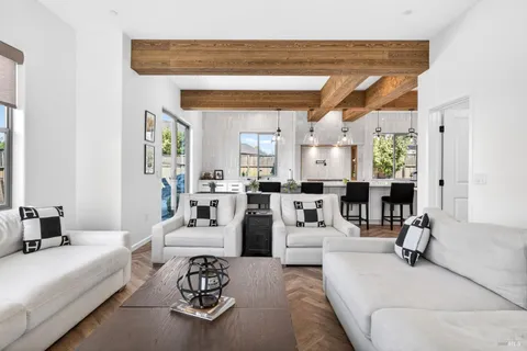 a bathroom with a granite countertop shower sink and mirror