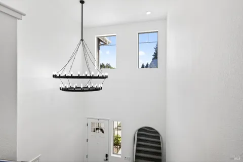 a view of balcony with couch and chairs