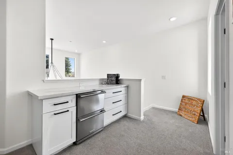 a view of kitchen with wooden floor