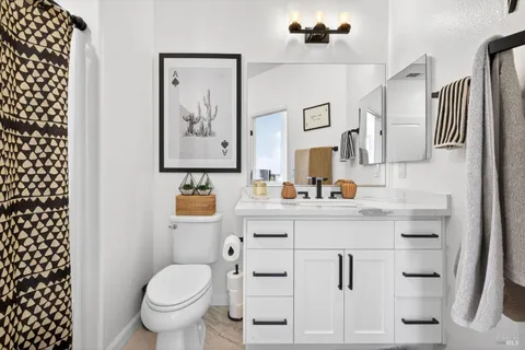 a view of a dinning table and chairs in the patio