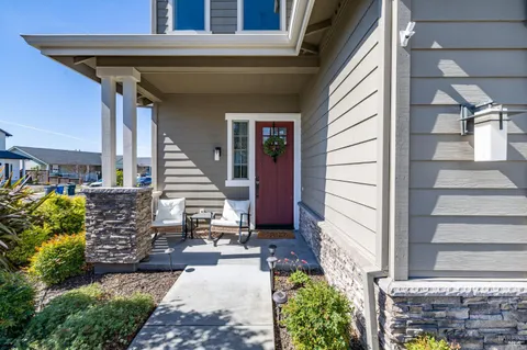 a large white kitchen with a large window