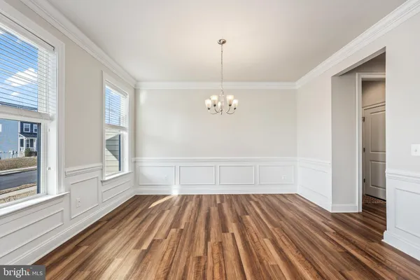 a bathroom with a sink mirror and toilet
