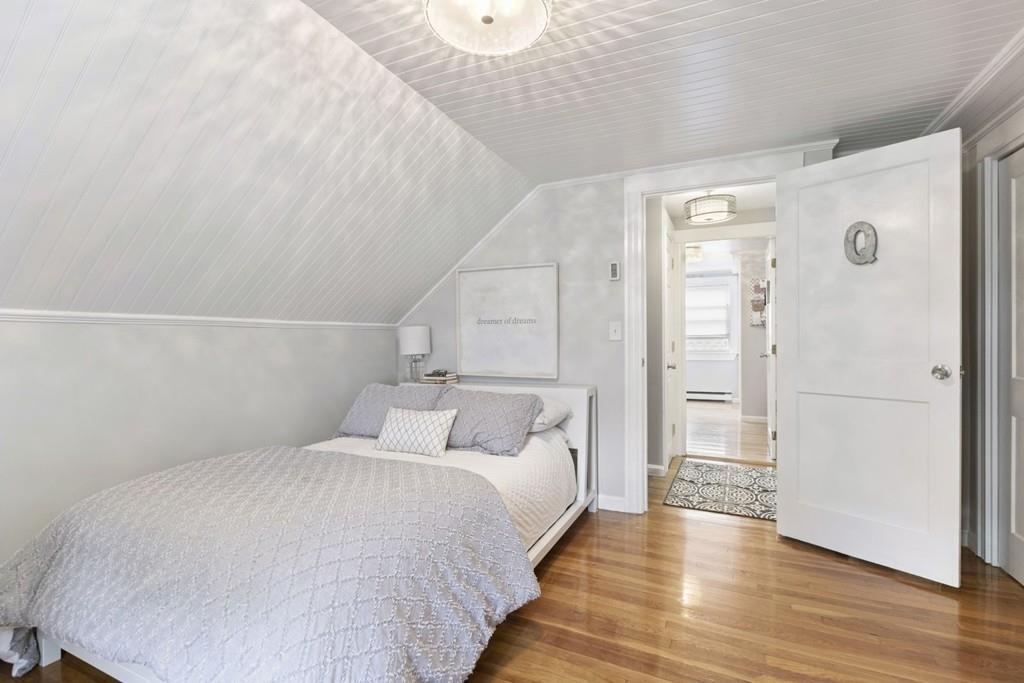 4 Bryn Mawr Road Wellesley, MA 02482 - Photo 12 of 27 a bedroom with a bed and wooden floor