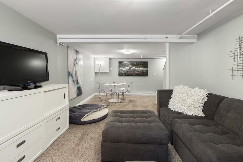 4 Bryn Mawr Road Wellesley, MA 02482 - Photo 16 of 27 a living room with furniture and a flat screen tv