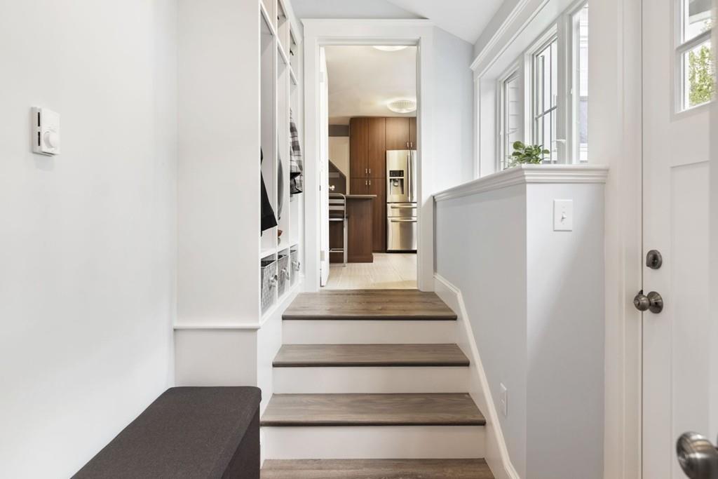 4 Bryn Mawr Road Wellesley, MA 02482 - Photo 18 of 27 a view of staircase with white walls and windows