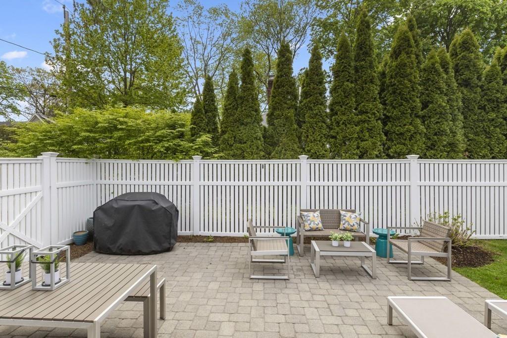 4 Bryn Mawr Road Wellesley, MA 02482 - Photo 19 of 27 a roof deck with couches and wooden fence