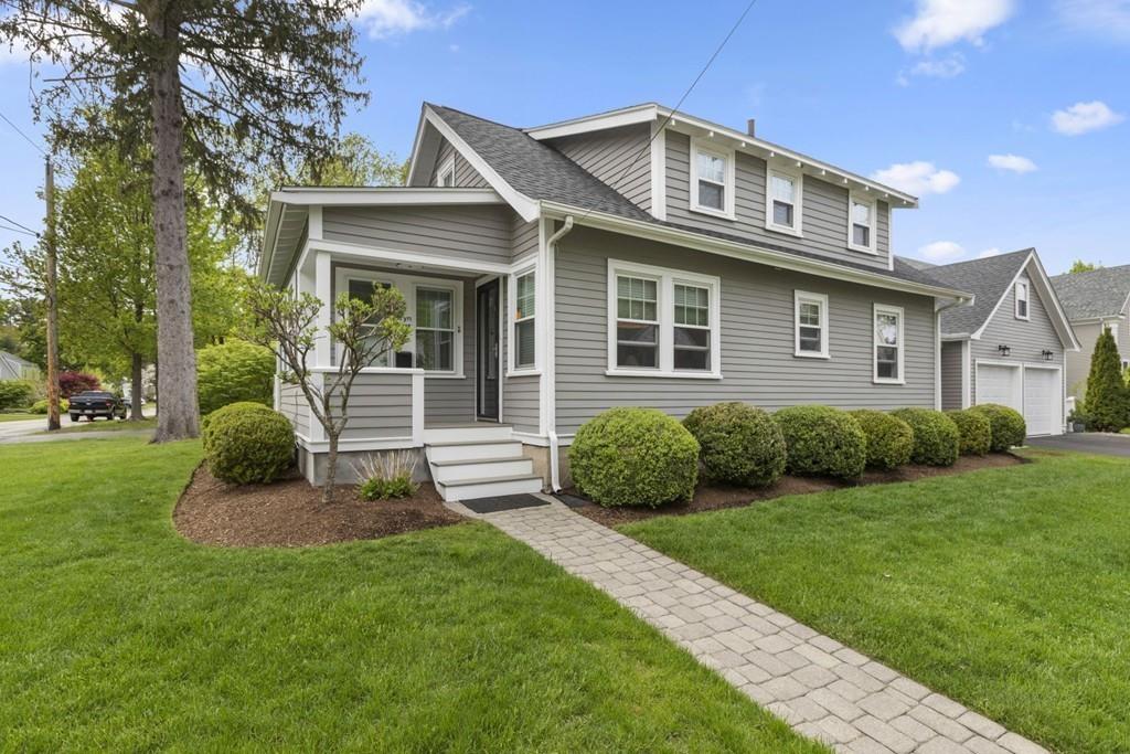 4 Bryn Mawr Road Wellesley, MA 02482 - Photo 22 of 27 a front view of a house with a yard