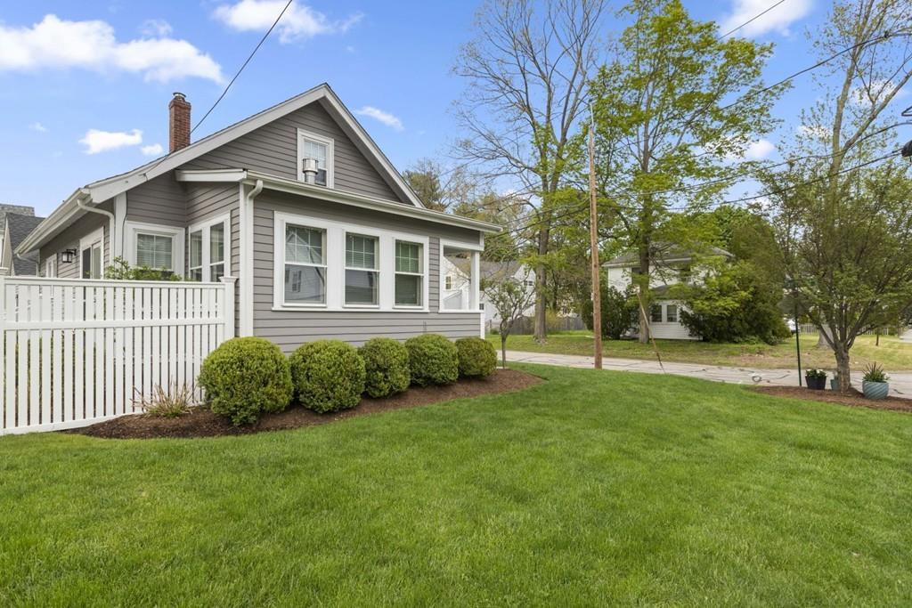 4 Bryn Mawr Road Wellesley, MA 02482 - Photo 23 of 27 a front view of a house with a garden