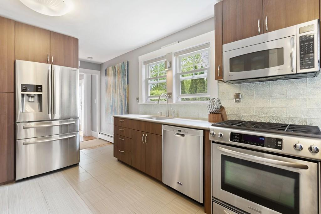 4 Bryn Mawr Road Wellesley, MA 02482 - Photo 3 of 27 a kitchen with stainless steel appliances a stove microwave and refrigerator