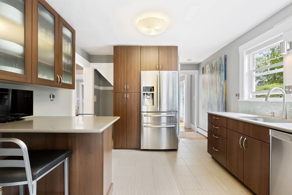 4 Bryn Mawr Road Wellesley, MA 02482 - Photo 4 of 27 a kitchen with a refrigerator a sink and a stove