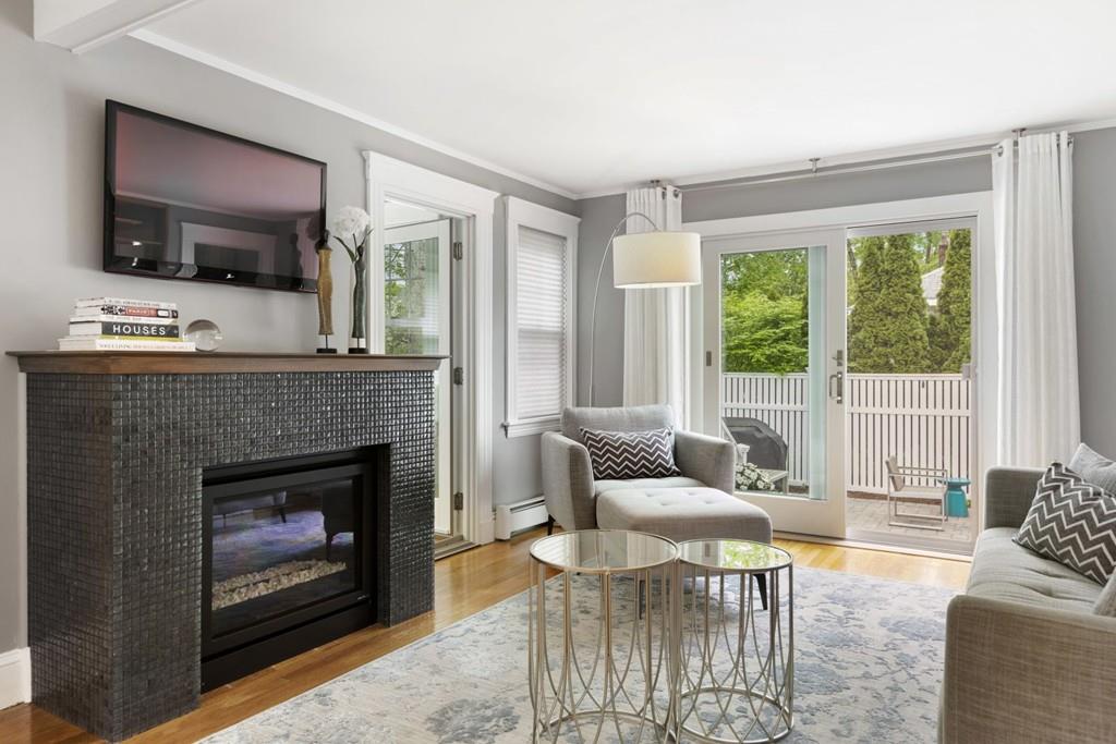 4 Bryn Mawr Road Wellesley, MA 02482 - Photo 7 of 27 a living room with furniture a flat screen tv and a fireplace
