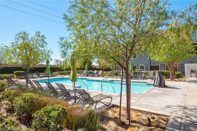 a view of a park with iron fence