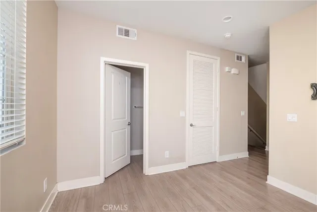 a view of a hallway with closet