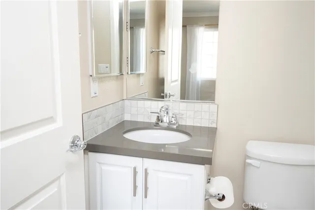 a bathroom with a sink and mirror