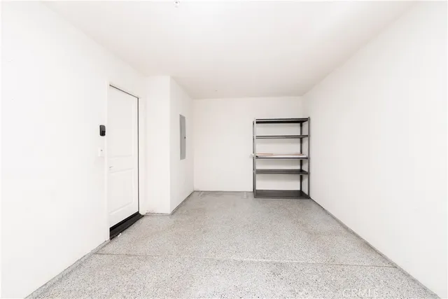 a kitchen with granite countertop a refrigerator stove and sink