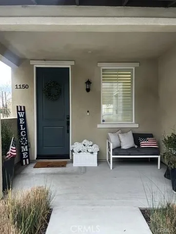 a kitchen with a sink and chairs