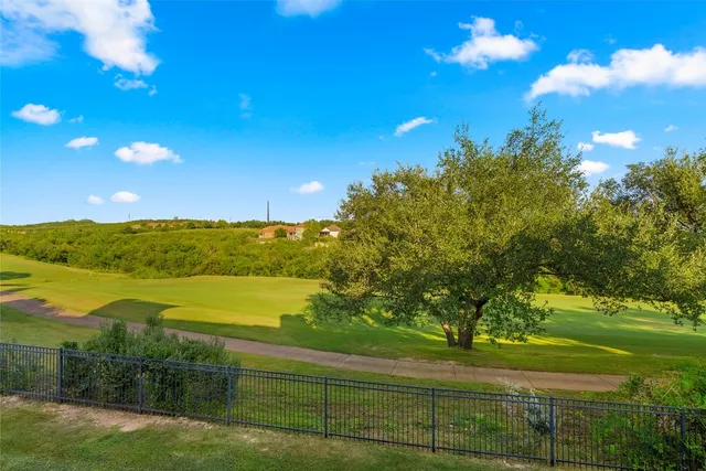 a view of a balcony with wooden floor