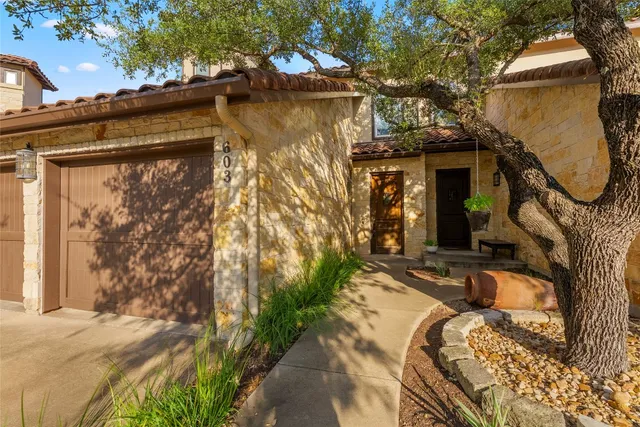 a view of a house with a snow on the road