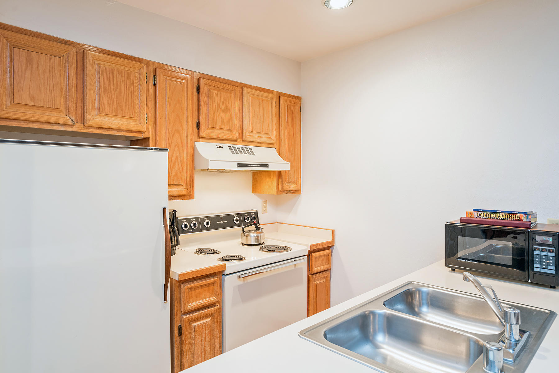 800 Black Bear Road, Unit 11 Telluride, CO 81435 - Photo 3 of 11 a kitchen with a sink cabinets and appliances