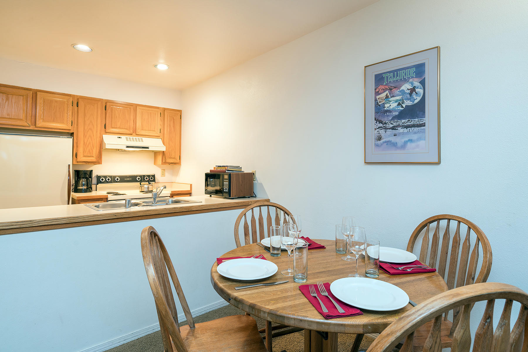 800 Black Bear Road, Unit 11 Telluride, CO 81435 - Photo 4 of 11 a table and chairs in a kitchen