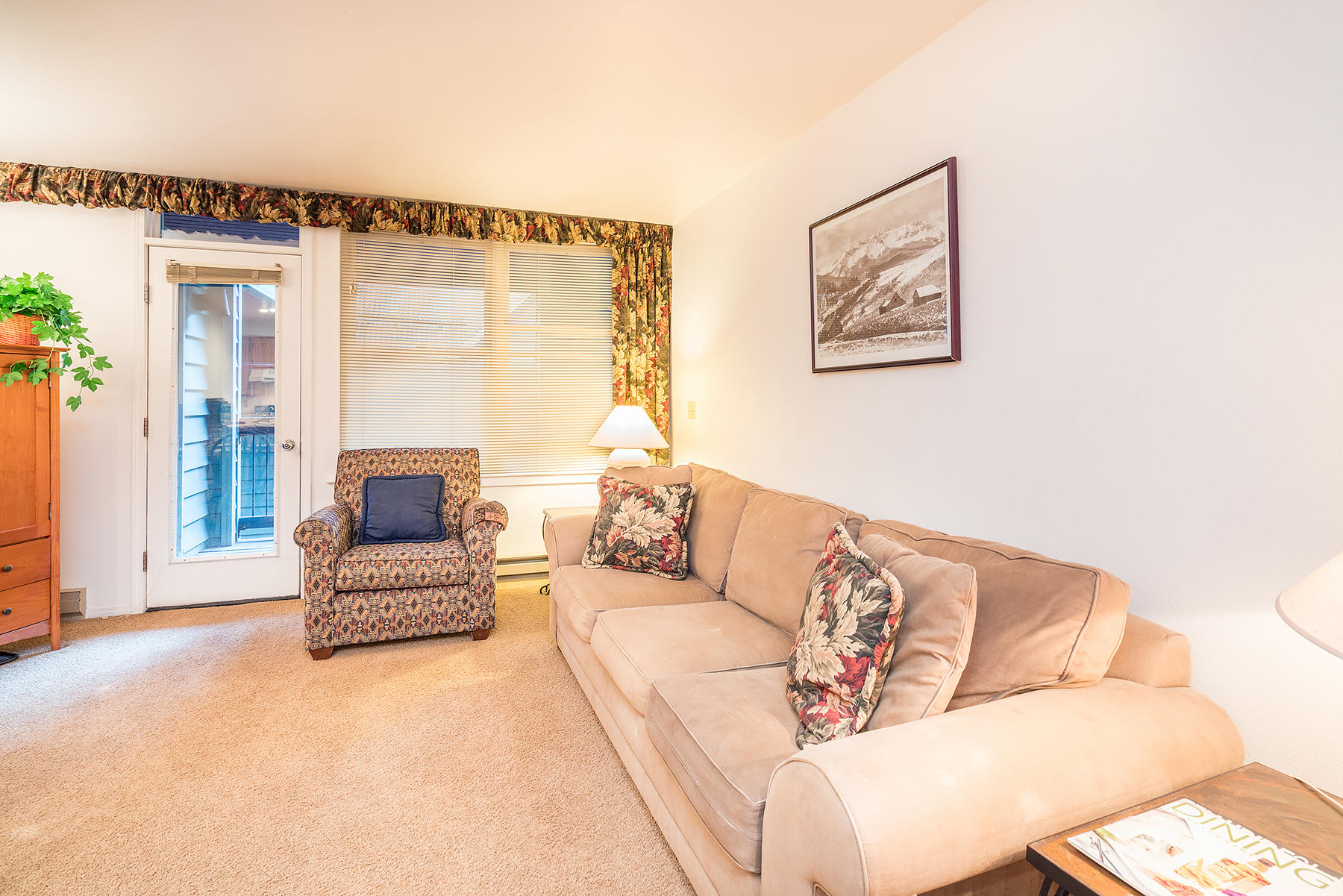 800 Black Bear Road, Unit 11 Telluride, CO 81435 - Photo 5 of 11 a living room with furniture and a large window
