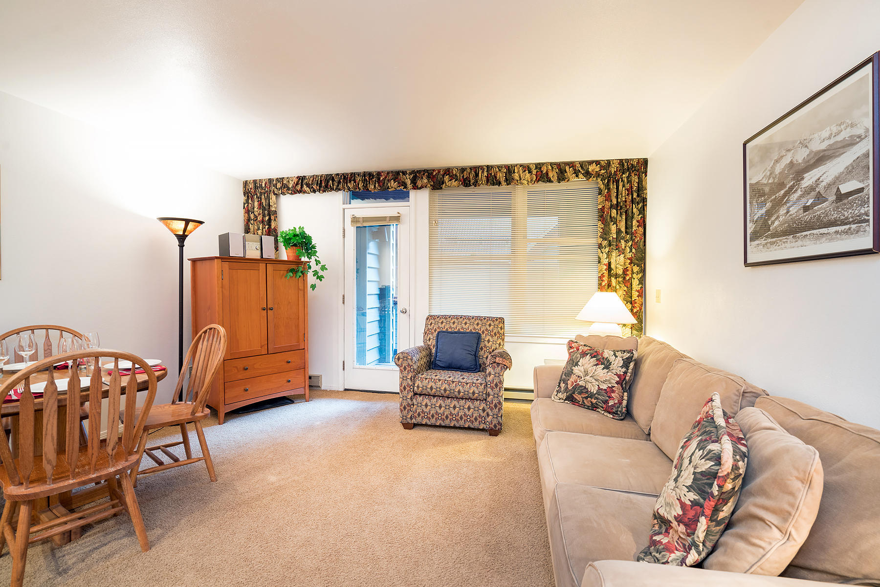 800 Black Bear Road, Unit 11 Telluride, CO 81435 - Photo 6 of 11 a living room with furniture a couch and a window