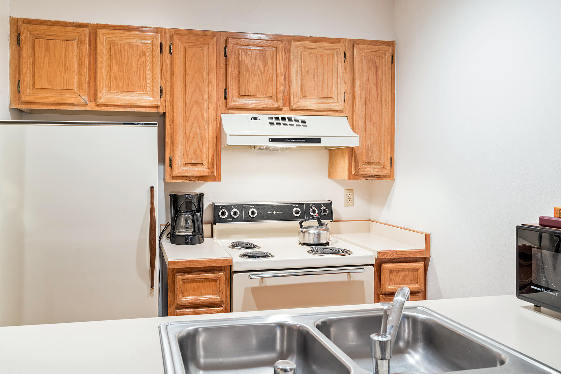 800 Black Bear Road, Unit 11 Telluride, CO 81435 - Photo 9 of 11 a kitchen with a stove and a sink