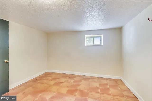 an empty room with a workbench